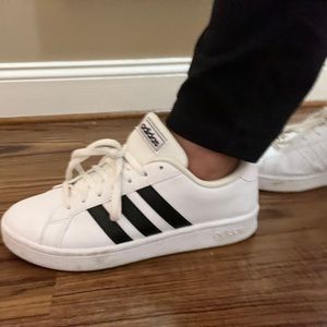 Womens ADIDAS sneakers. Slightly used. White and black stripes.